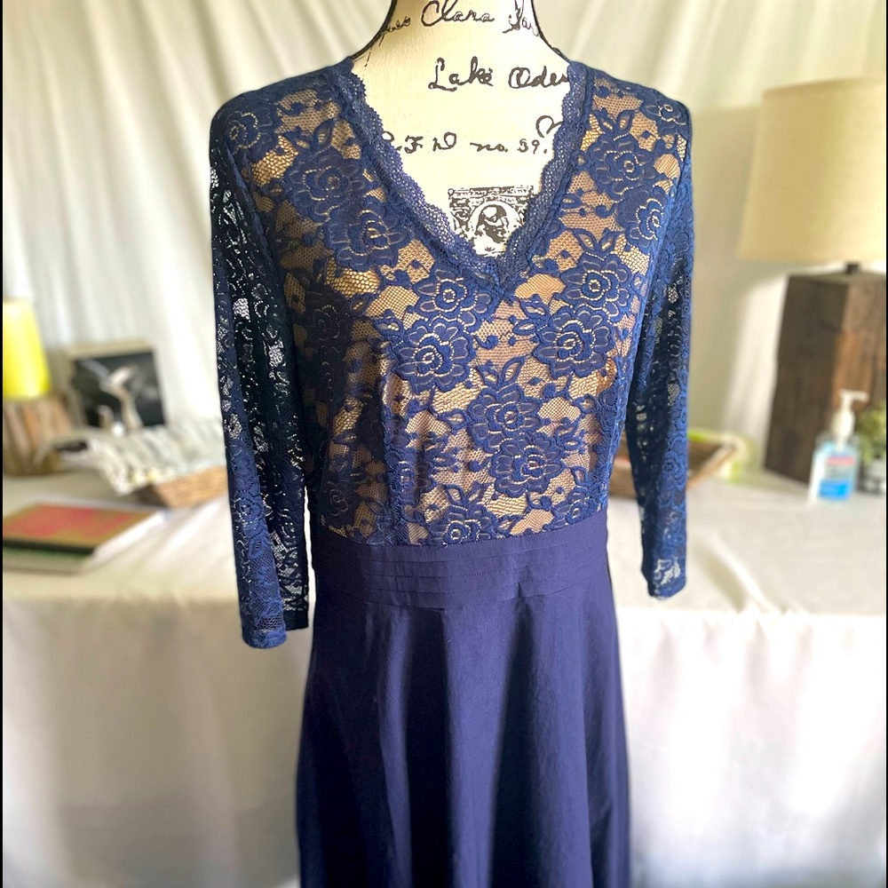 Brand new with tag. Navy blue dress up to your knees.